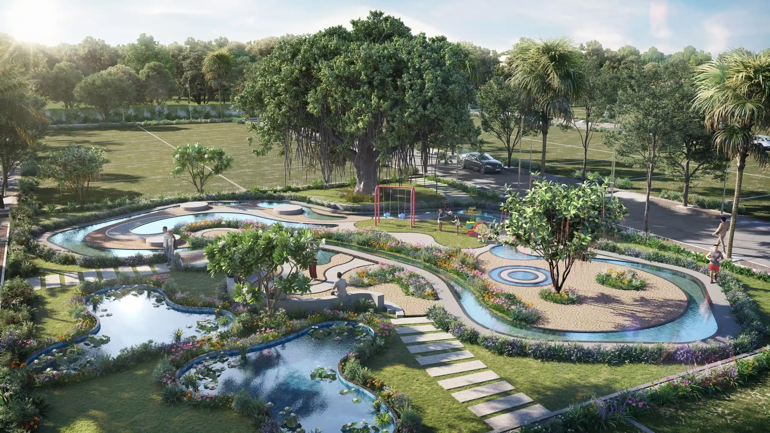 Aerial view of site for sale in Tumkur featuring landscaped park, water features and pathways